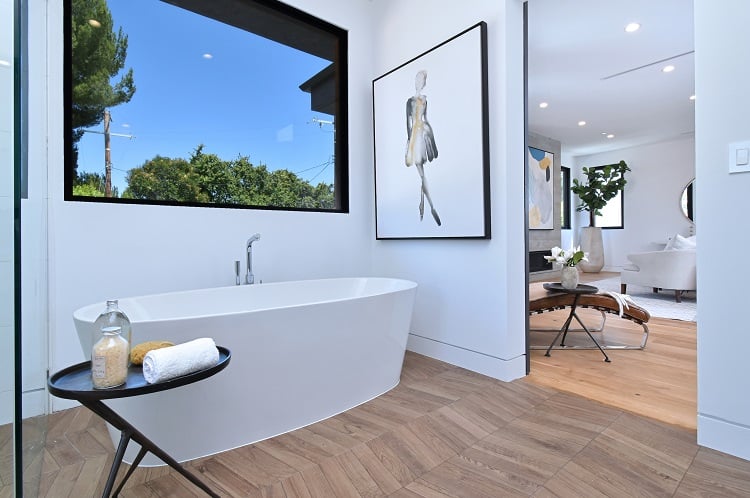 modern bathroom with a freestanding tub and a view