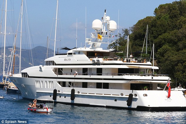 High water mark: The friends are enjoying a vacation aboard this luxury yacht