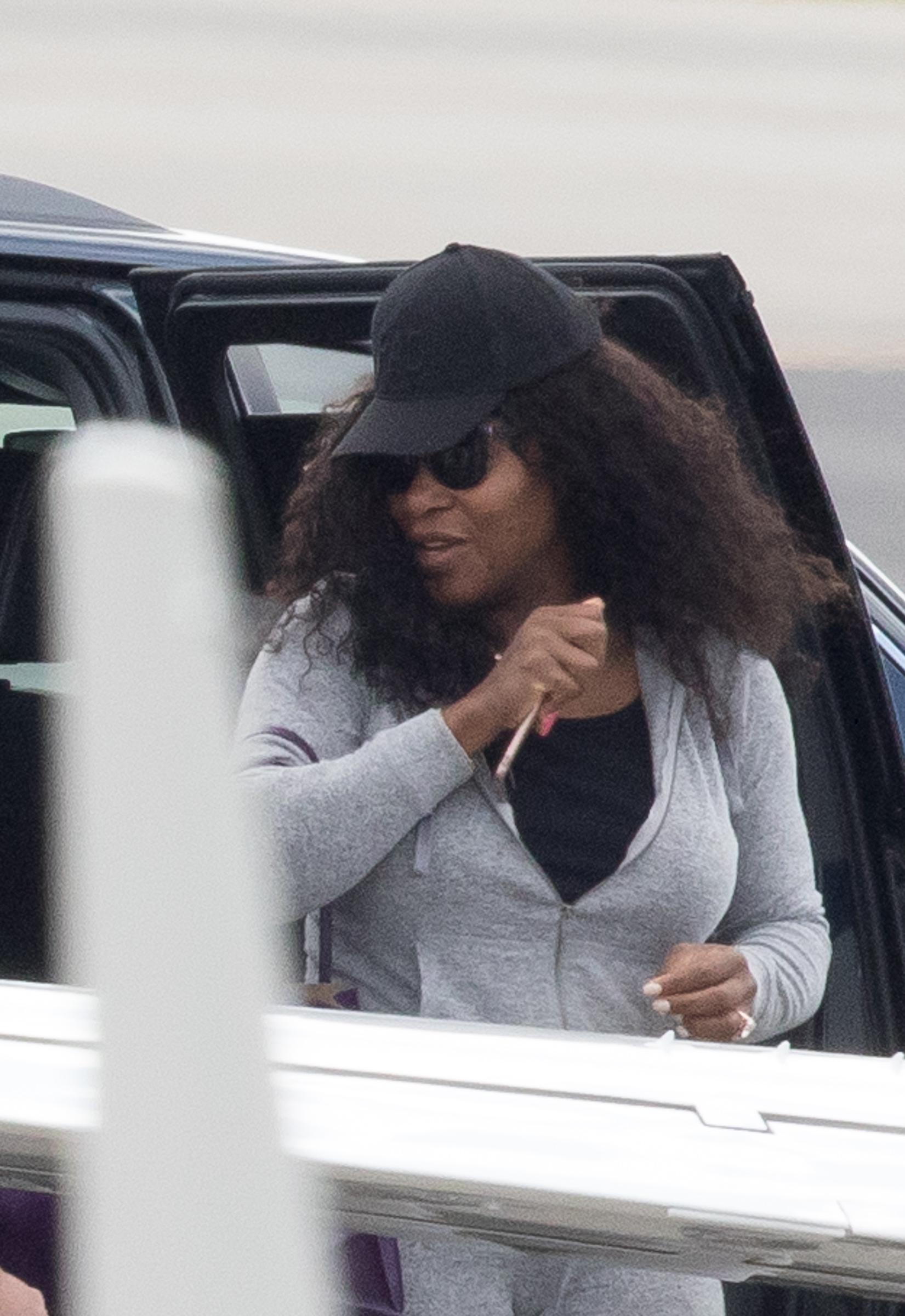  Serena wore a baseball cap and dark sunglasses