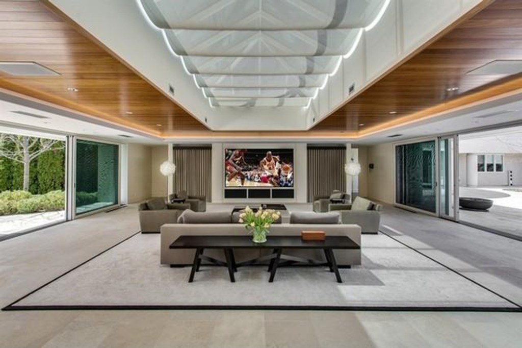 An open-floor expansive living room with slide doors. 