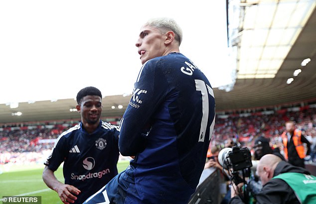 Garnacho celebrated his goal by sitting on the advertising board and crossing his arms