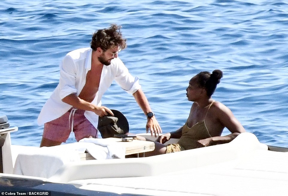 Although neither Williams or Preti have confirmed if they are in a relationship, their chemistry was palpable as he stood behind her and held onto her shoulders as they mingled with friends