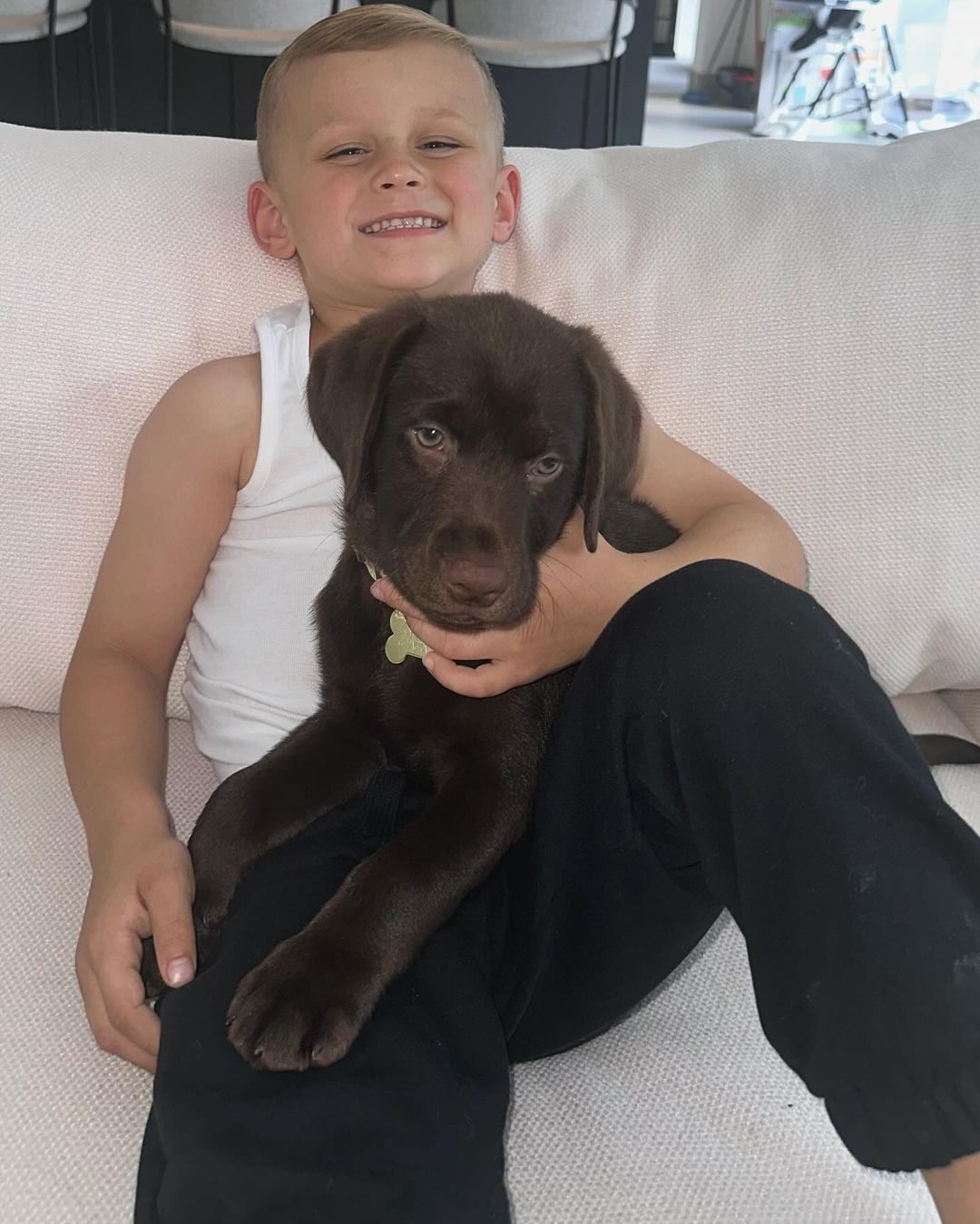 Man City star Phil Foden and his son Ronnie shares happy moments for a photo with their new dog 🐶🤎