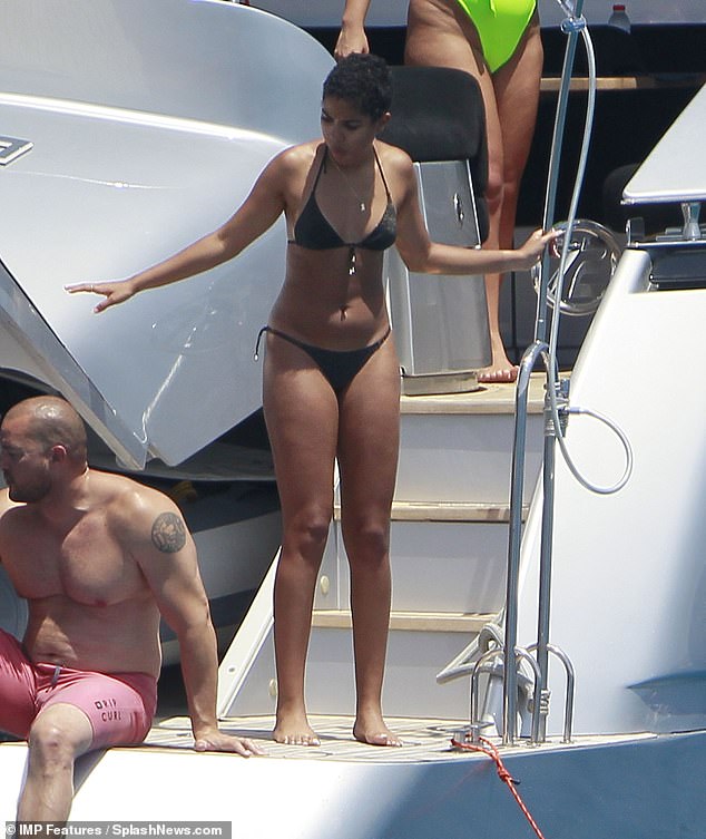 Who's that? Shaq was joined by a bikini-clad companion with the couple on cozy display