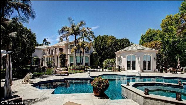 Backyard view: The estate includes a large pool and cabanas