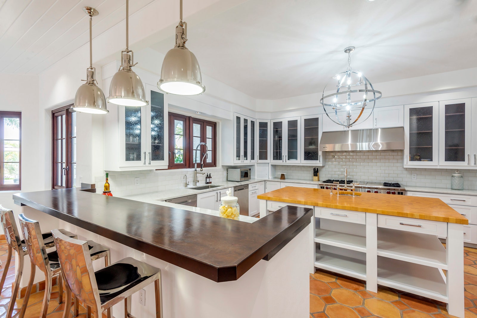 Image may contain Indoors Room Kitchen Island Interior Design Kitchen Furniture and Chair