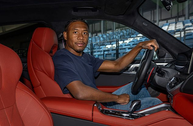 Too cool for school: David Alaba stayed calm as he posed inside his uber-expensive XM